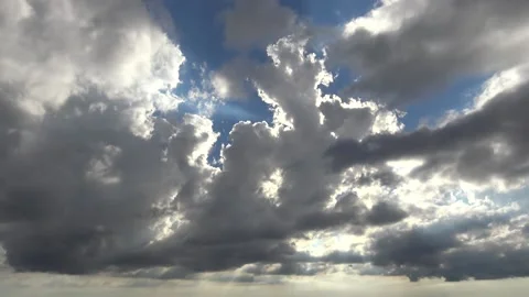 Sun shinning through dark clouds Stock Footage 159074951