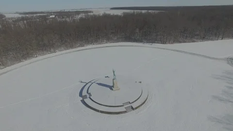 Sun Singer statue in Snow at Allerton Park [Orbit right]1 Stock Footage 128467517