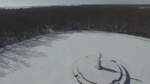 Sun Singer statue in Snow at Allerton Park [Orbit Right]2 color corrected Stock Footage 128503269