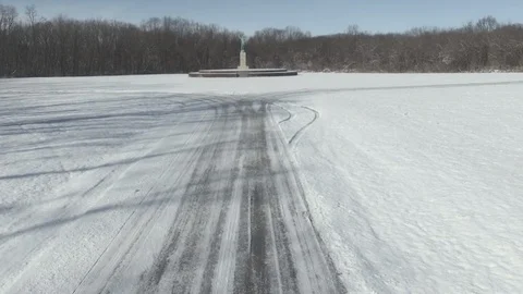Sun Singer statue in Snow at Allerton Park [Dolly In] (color corrected) Stock Footage 128542883