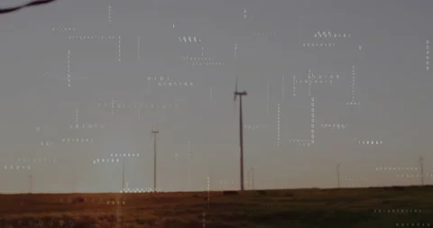 Sun sinking below horizon causing binary code drifting while turbine rotating Stock Footage 312898151