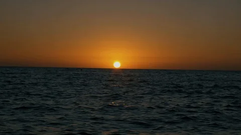 Sun sinking into the horizon at the sea Stock-Footage 124755573