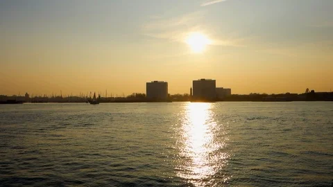 The sun sits low in the sky over Gosport Stock Footage 105583929