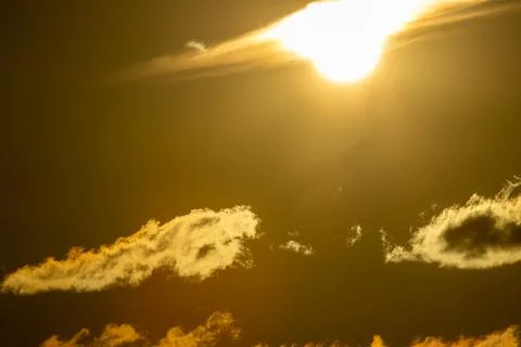 Sun, sky, and clouds Stock Photos