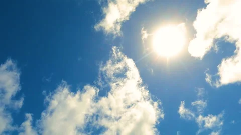 Sun in the sky with clouds. Clouds moving near the sun. Bright day Stock Footage 212498669