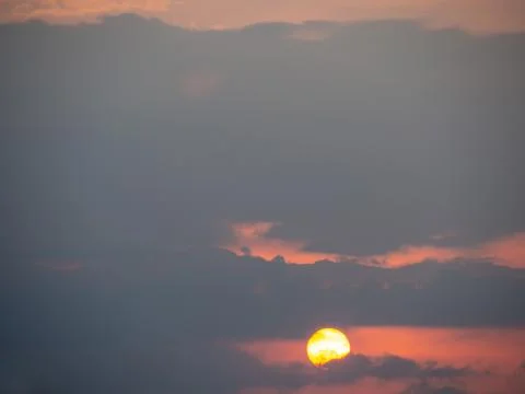The sun in the sky in the evening time Stock Photos