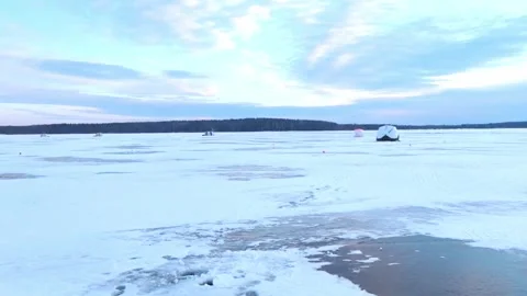 As the sun slowly descends below the horizon, casting a warm golden glow across Stock Footage 342579388