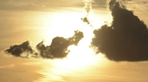 Sun slowly melts away clouds time lapse 4K version zoomed Stock Footage 39616582