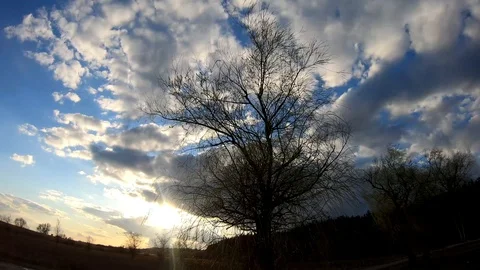 The sun slowly peeks out from behind the clouds. Stock Footage