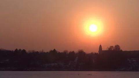 Sun Slowly Setting Above The Church City Frozen Lake Trees Stock Footage