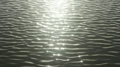 Sun sparkles on grey waves sharp focus Stock Footage 73340089