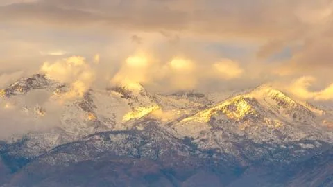 Sun streaming through thick clouds at Lone Peak UT Stock-Fotos