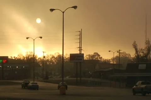Sun, sunlight through thick clouds taken from store parking lot Stock Footage 10764903