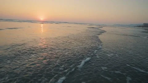 The sun at sunset on a beach without people Video stock 130408485