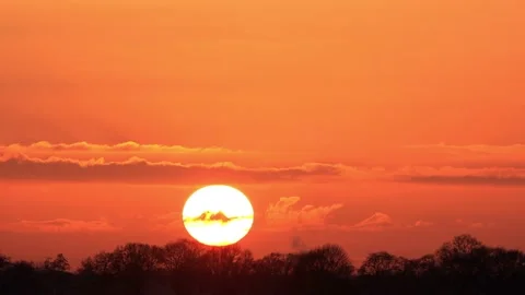 Sun sunset in the red orange sky timelapse Stock Footage 173605388