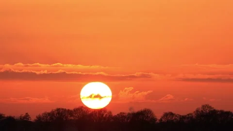 Sun sunset in the red orange sky timelapse Stock Footage 203388840