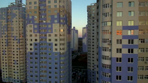 Sun at sunset reflects and shimmers in the windows of tall buildings. Stock Footage 131768670