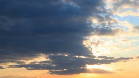 Sun Sunshine Through Sunset Sky. Bright Dramatic Sky With Fluffy Clouds. Yellow Stock Footage 127431832