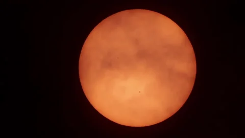 Sun With Sunspots in Telescope Behind Clouds at Sunrise. Sun Spots Shining Th Stock Footage 160155017