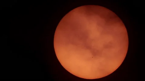 Sun With Sunspots in Telescope Behind Clouds at Sunrise. Sun Spots Shining Th Stock Footage 162759130