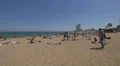 Sun tanning on the beach in Barcelona 4k or 4k+ Resolution