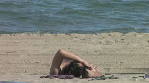 Sun Tanning on the Beach 스톡 동영상 10810943