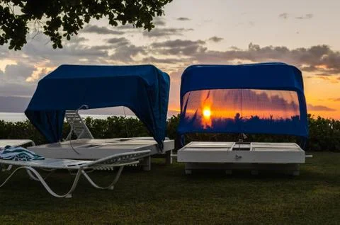 The sun through the chaise-longe Stock Photos