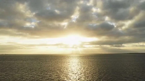 Sun through clouds above European lake rising Stock Footage 155461193