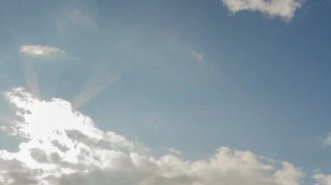 Sun through clouds and blue sky time lapse HD Video stock 35146567