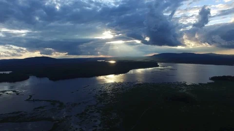 Sun through clouds at dusk Stock Footage 102125325