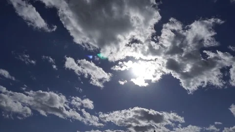 Sun through clouds Stock Footage 77663136