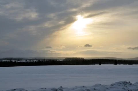 Sun through clouds wintertime Stock Photos
