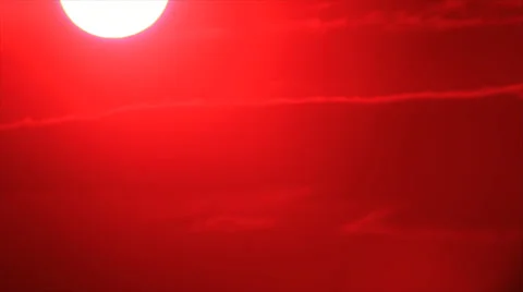 Sun through gapes on red dark sky Stock-Footage 34760586