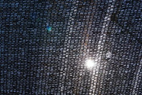 The sun through the ship's grid with glare Stock Photos