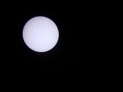 Sun through a solar filter and telescope with planet Mercury Stock Photos