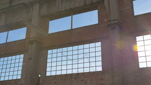 Sun through windows of an old abandoned factory Stock Footage