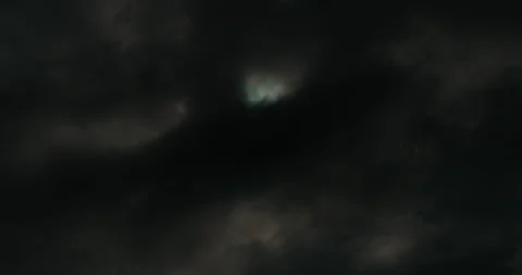 Sun Time-lapse through Dark Clouds Stock Footage 224705724