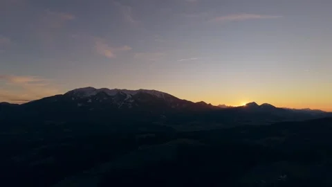 Sun touching alpine horizon Stock Footage 329405726