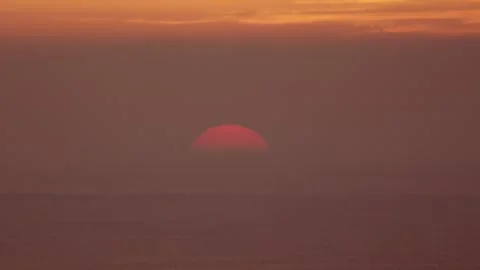 Sun Touching the Ocean Horizon at Sunset Video stock 311332157