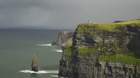 Sun on tower atop Cliffs of Moher on Cloudy day Stock Footage 170036012