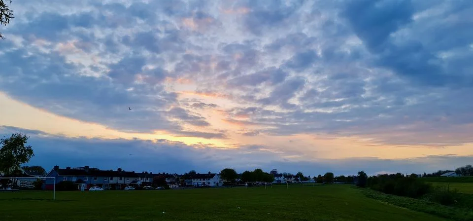 Sun trough the clouds Stock Photos