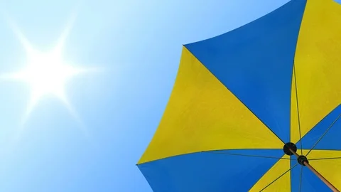 Sun umbrella under summer sky Stock Footage 91387422
