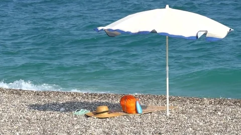 Sun umbrella waving in nice sunny weather Stock Footage 80439809