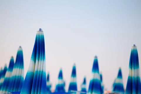 Sun umbrellas on blue sky background Foto stock