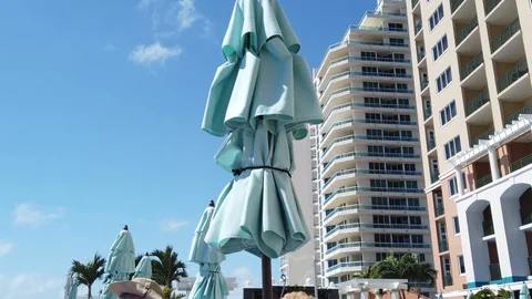 Sun umbrellas in wind Stock Footage 107948819