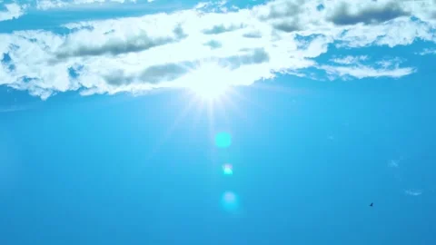 Sun under a White Cloud Azure Clear Sky, Sun Glare and Rays Sunlight, Daylight,  Stock Footage 241415819
