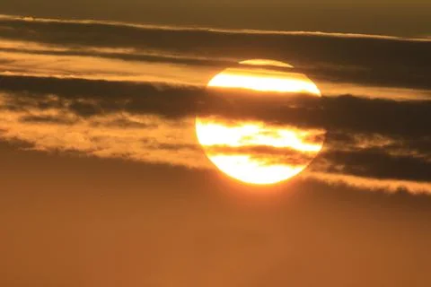 Sun visible through clouds Stock Photos