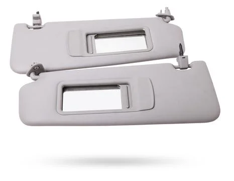 Sun visor with a mirror made of light gray plastic on a white background in.. Stock Photos