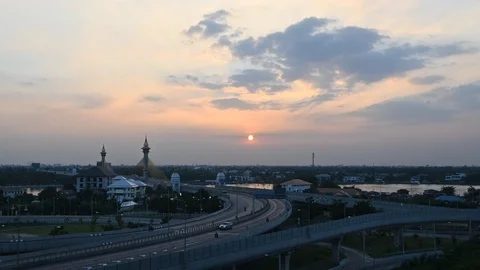The sun was moving low over the bridge and the city view. Video stock 124675530
