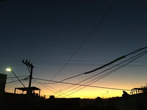 The sun was setting behind a big tree near the guarapiranga dam. The backligh Stock Photos